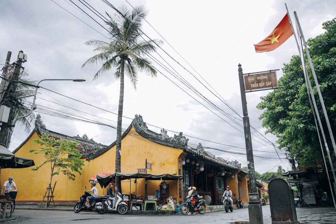 a yellow building with a flag