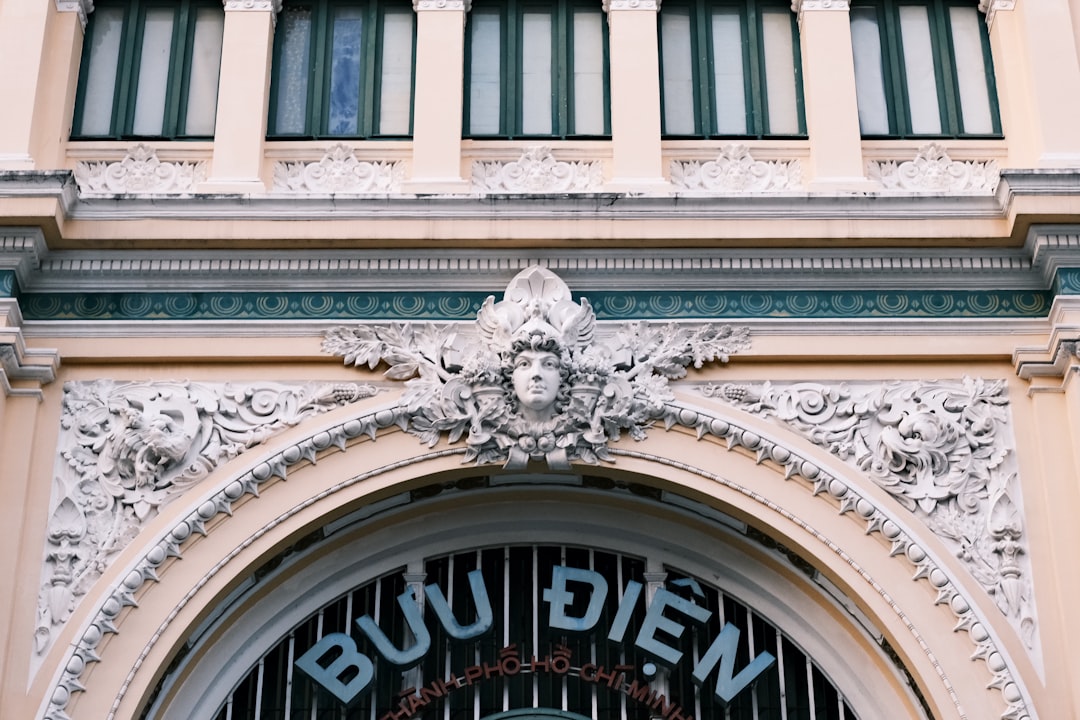 Ornate facade of a historic building with arched entryway.