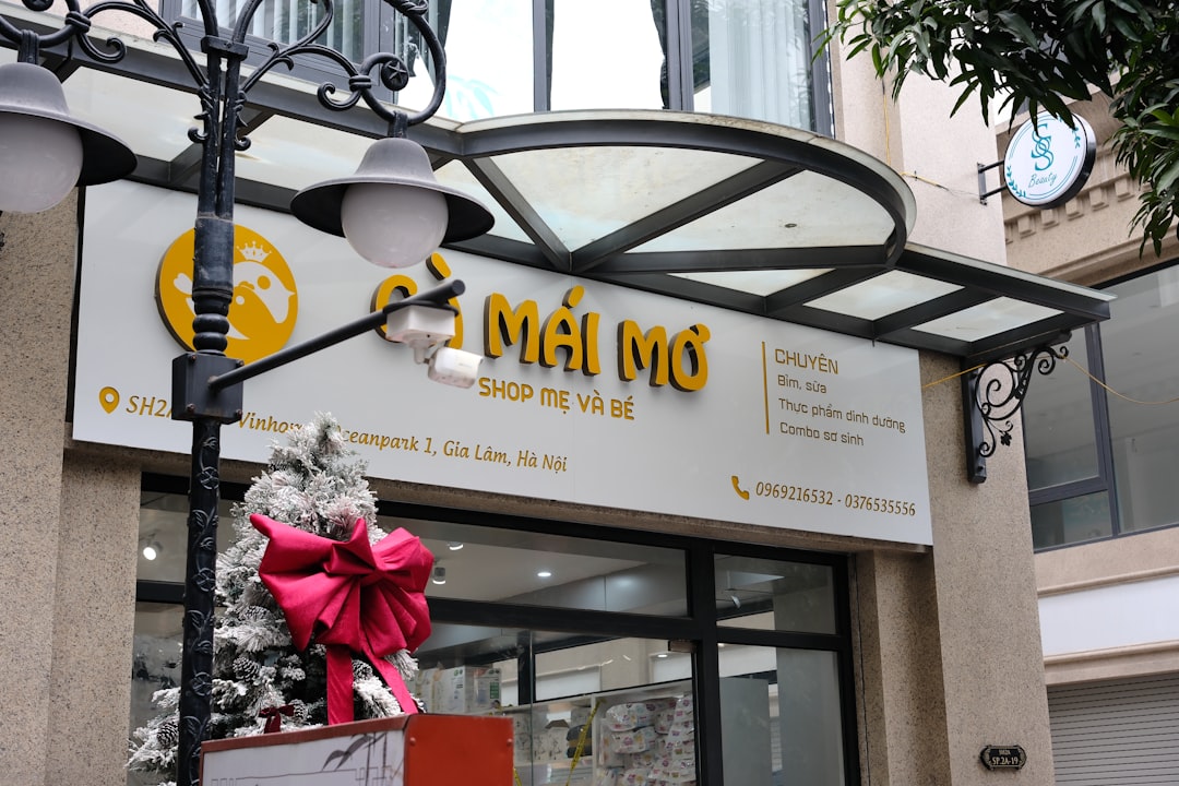 A building with a sign and a statue in front of it